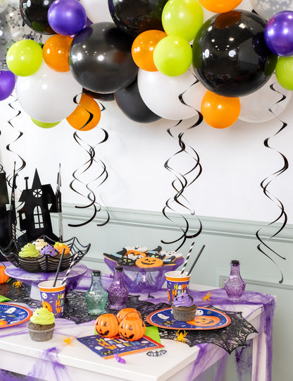 8 črnih spiralnih okraskov