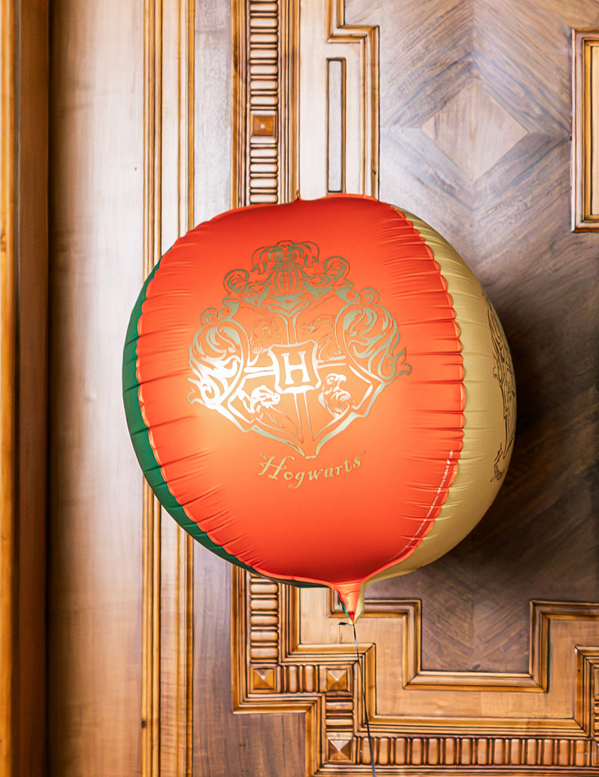 Ballon aluminium sphère Harry Potter™ Blason de Poudlard 50 cm