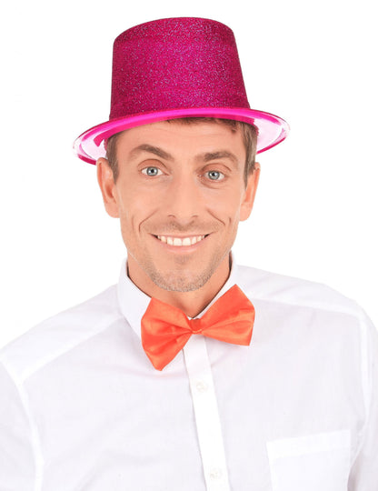 Vue de face du chapeau haut de forme en plastique pailleté pour adulte fuschia