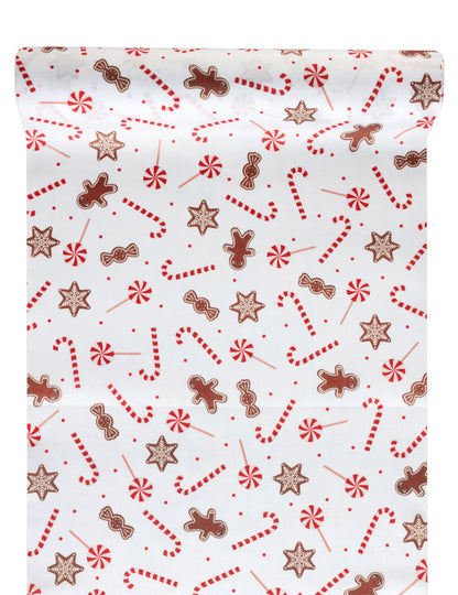 Chemin de table gourmandises de Noël blanc festif avec motifs sucres d'orge et bonhommes de pain d'épice