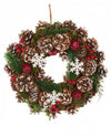 Couronne de Noël traditionnelle pour décoration avec pommes de pin et baies rouges