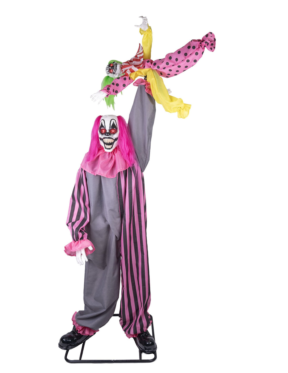 Vue de face de la décoration animée et sonore clown effrayant tenant une fille