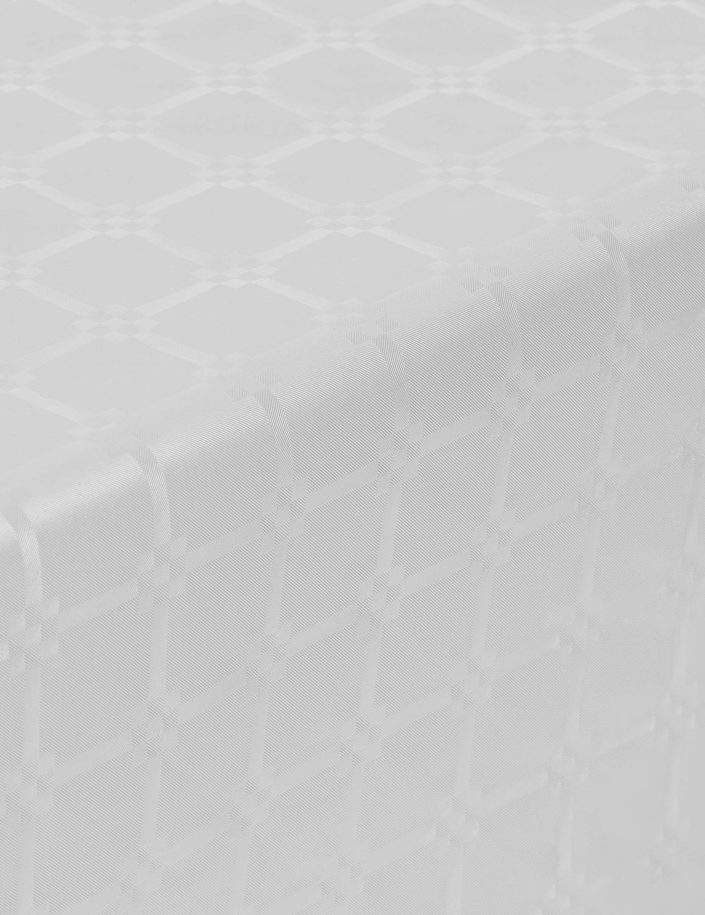 Détail du motif damassé de la nappe en rouleau papier damassé blanche