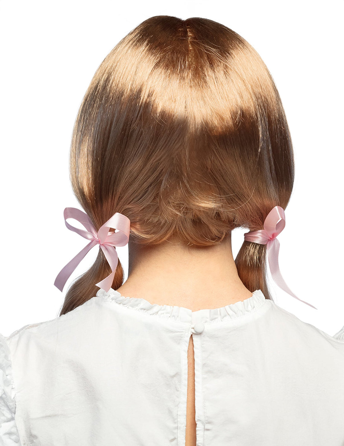 Vue de dos de la perruque écolière pour femme