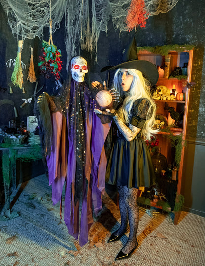 Squelette de voyante pour décoration Halloween violet et noir lumineux et sonore