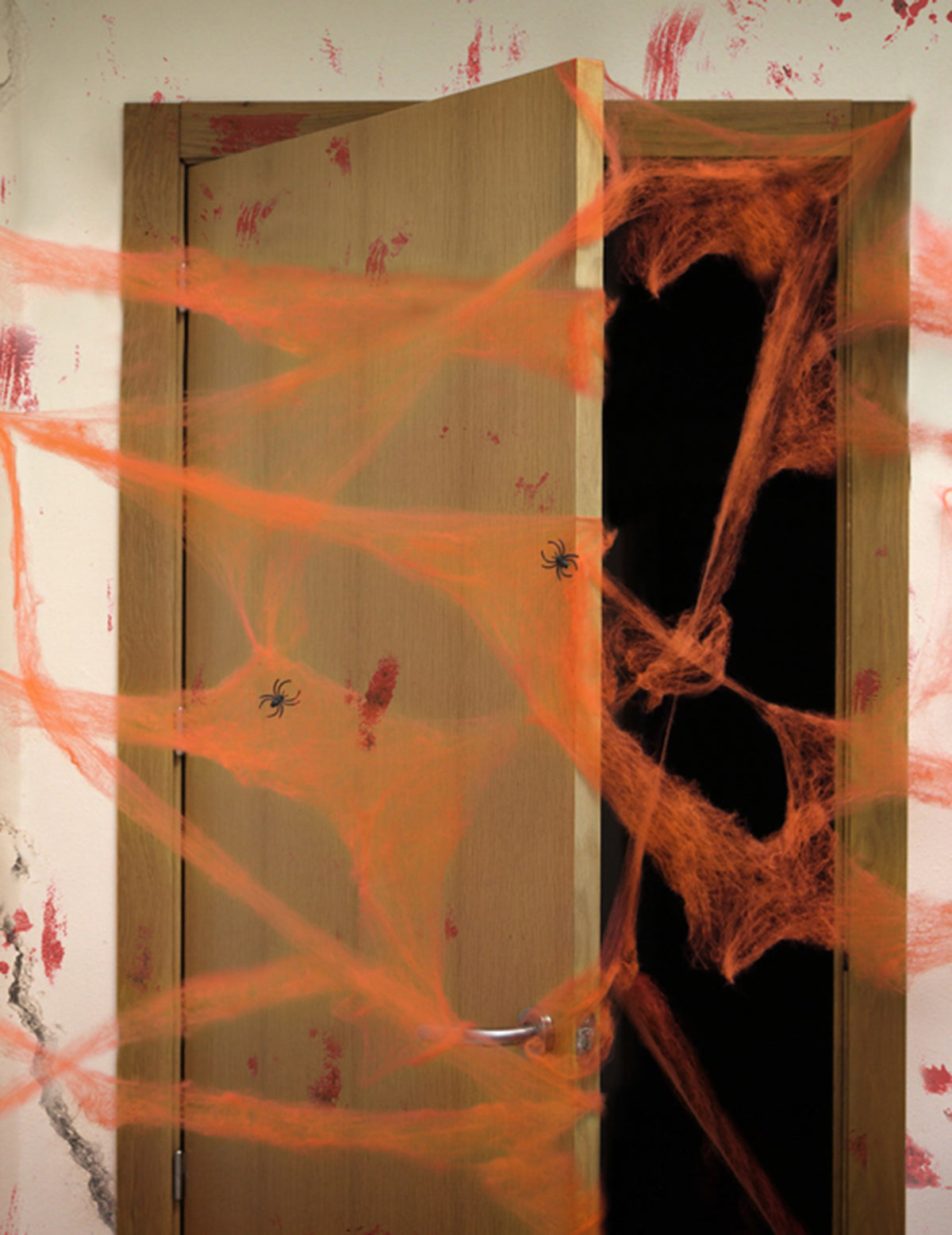 Oranžna pajčevina s pajki 20 g Halloween