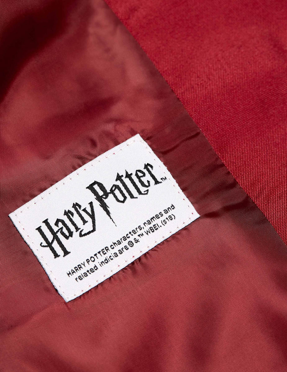 Podrobnost o etiketi jakne Mrs. Gryffondor za ženska Harry Potter Suitmeister